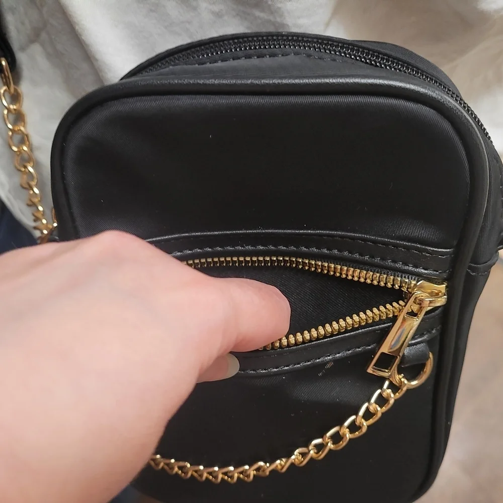 Elegant Black Crossbody Bag with Gold Accents